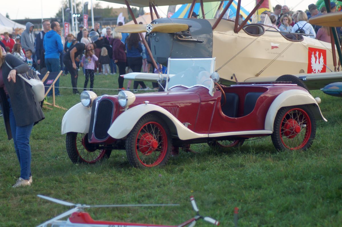115i23